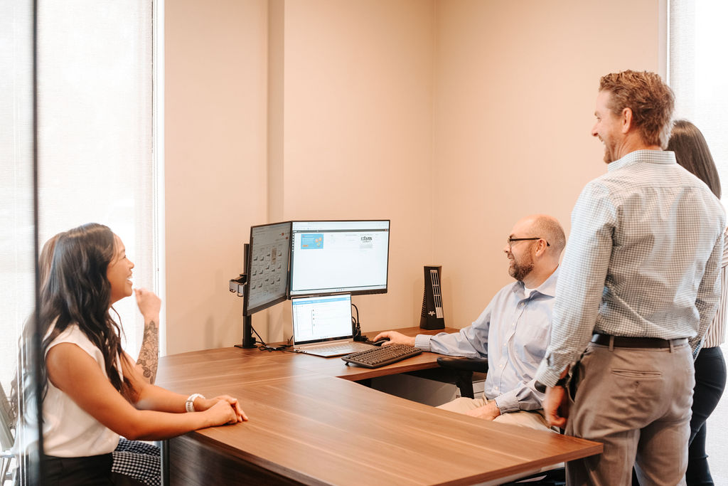 Mesa independent insurance agency team members reviewing insurance proposals for clients